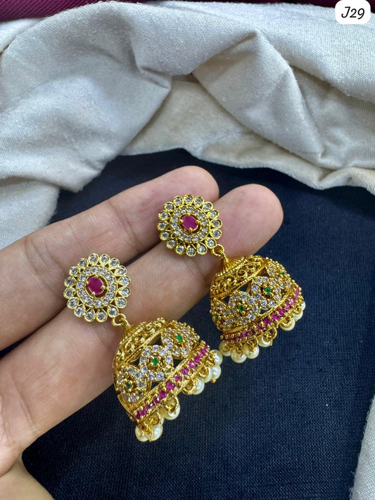 Matte Gold Jhumkas Ruby-Pink Accents and Cluster Pearl Fringes