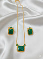 Elegant Emerald Green Stone Pendant Set with Gold Bead Border